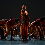 TLYDC group dance performance Trinity Laban Youth Dance Company group pose against a dark back drop