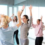 CYP Dance Spring Holiday students arms raised