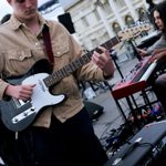 Young Musicians' Summer School, a guitarist and keyboard player perform on stage at the old royal naval college
