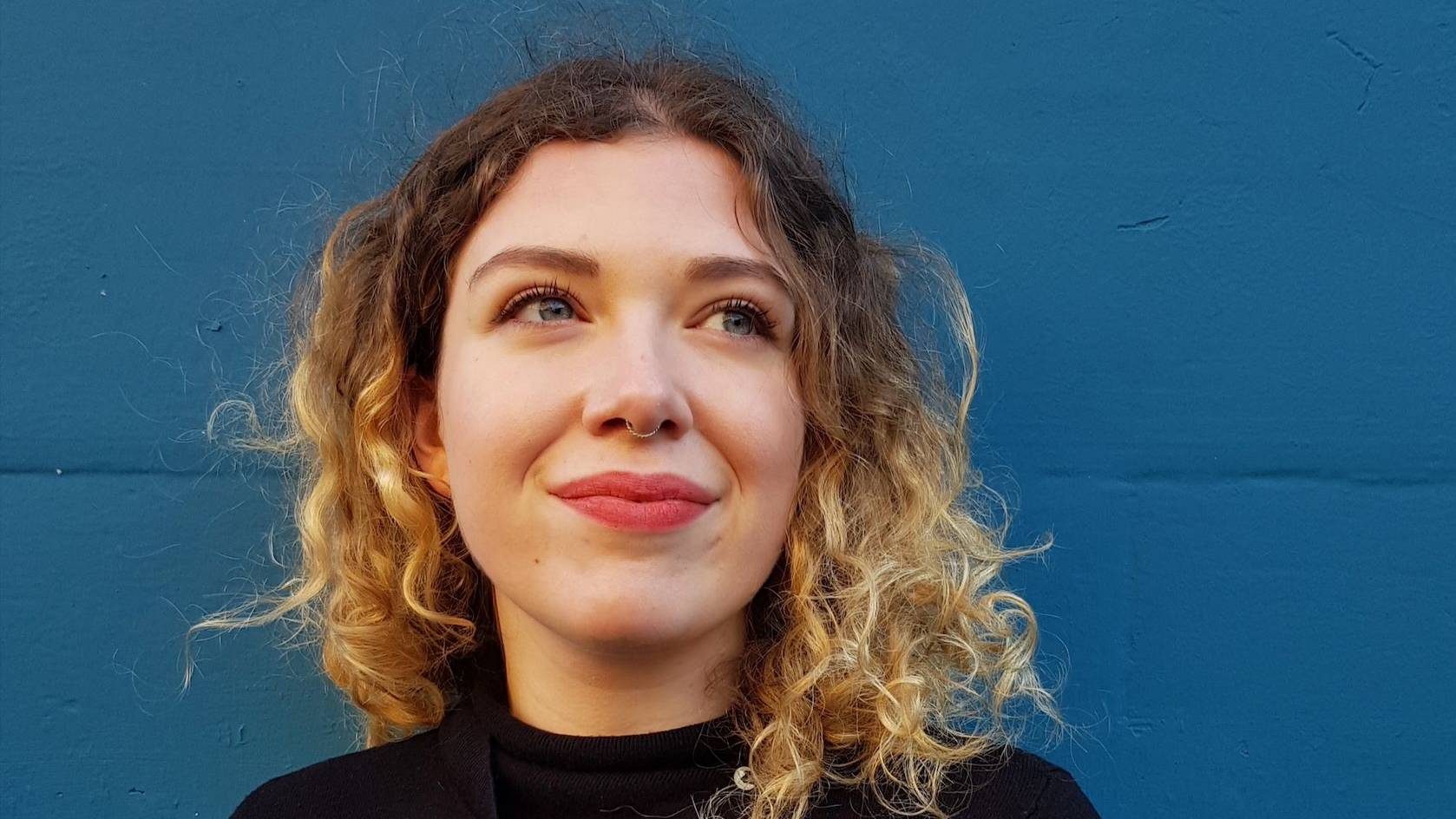 Composer Rowan McIlvride, she is wearing a black top and has brown/blonde hair