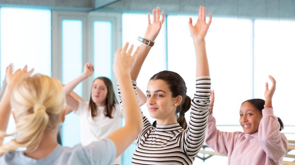 CYP Dance Spring Holiday students arms raised